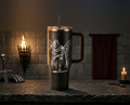Black 40oz engraved knight tumbler with handle on a castle stone ledge, kneeling knight between mandala shields, laser engraved stainless
