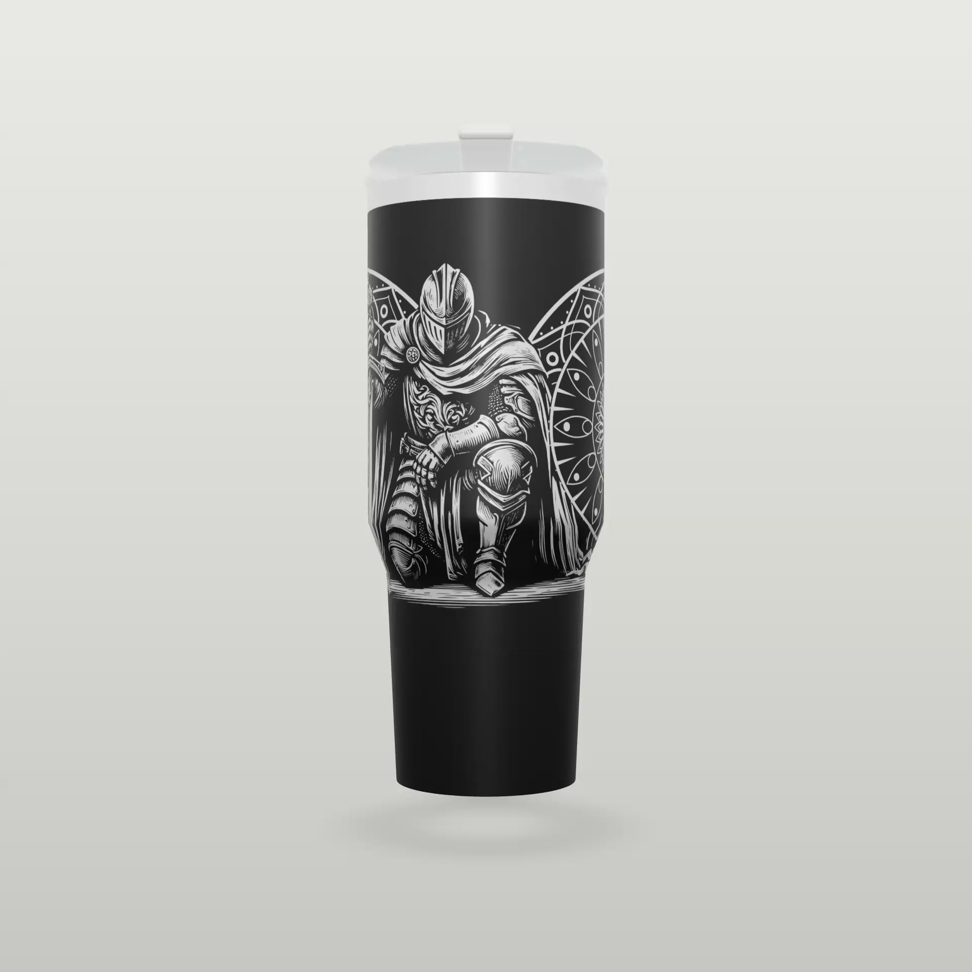 Black engraved knight tumbler spinning to show the full wrap design